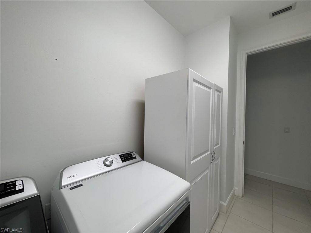8217 Lucello Terrace West Naples, FL 34114 - Photo 27 of 41 a utility room with dryer and washer