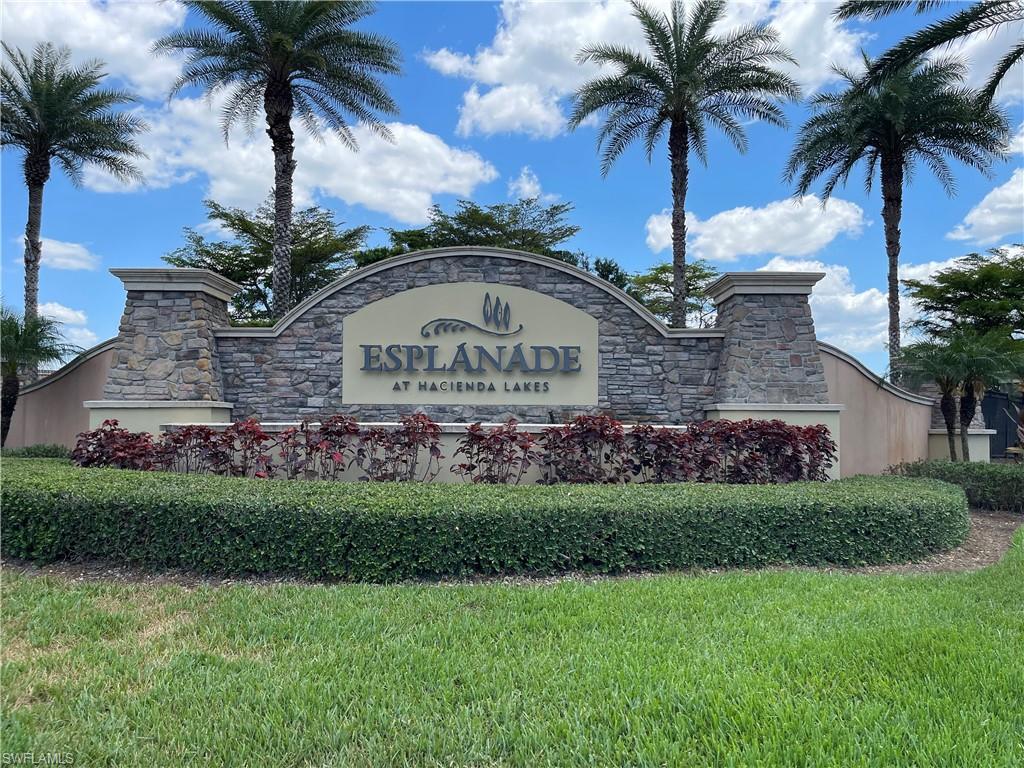 8217 Lucello Terrace West Naples, FL 34114 - Photo 28 of 41 a front view of multi story residential apartment building with yard and green space