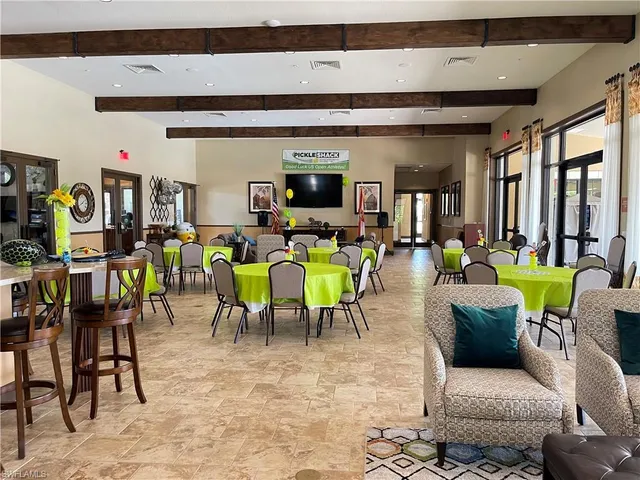 a lobby with furniture and floor to ceiling window