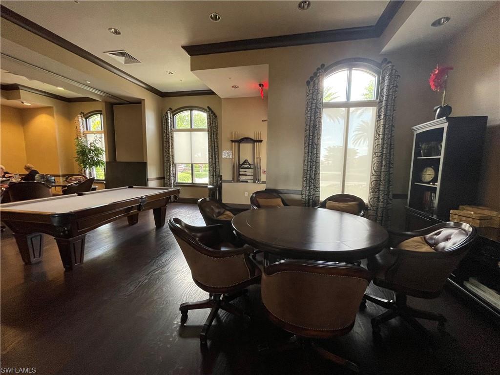 8217 Lucello Terrace West Naples, FL 34114 - Photo 39 of 41 a dining room with furniture and wooden floor