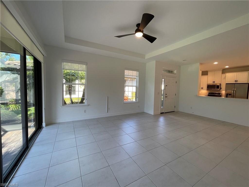 8217 Lucello Terrace West Naples, FL 34114 - Photo 10 of 41 a view of a livingroom with a ceiling fan and window
