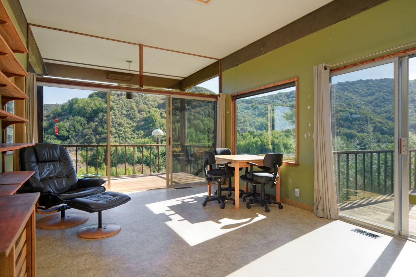 26969 Moody Road Los Altos Hills, CA 94022 - Photo 29 of 52 a living room with furniture and floor to ceiling windows