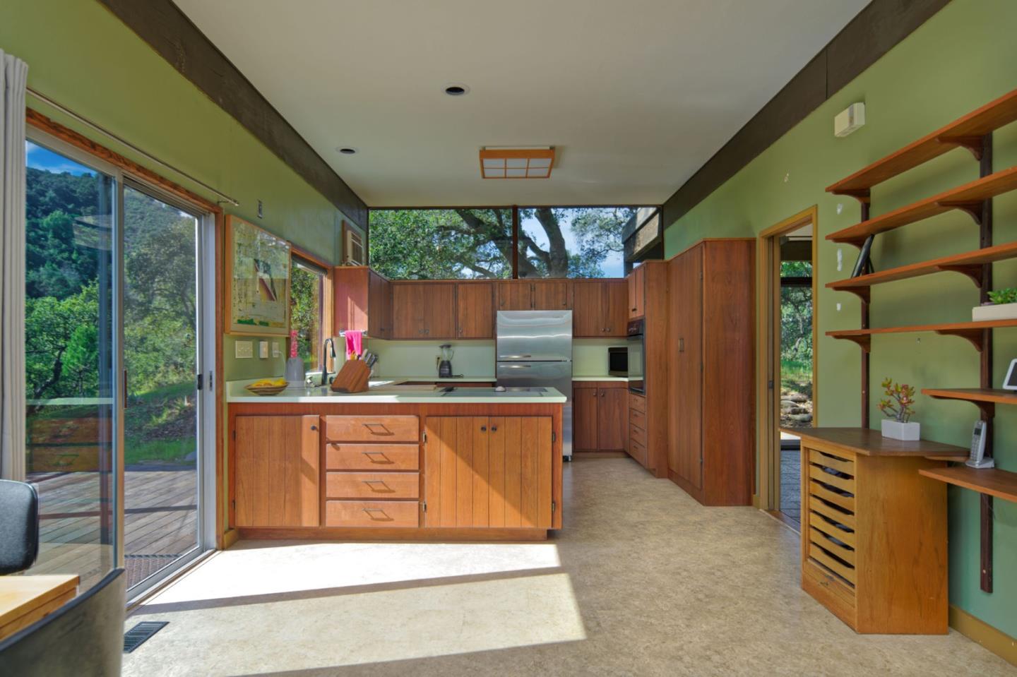 26969 Moody Road Los Altos Hills, CA 94022 - Photo 31 of 52 a kitchen with stainless steel appliances granite countertop a refrigerator and a wooden fence