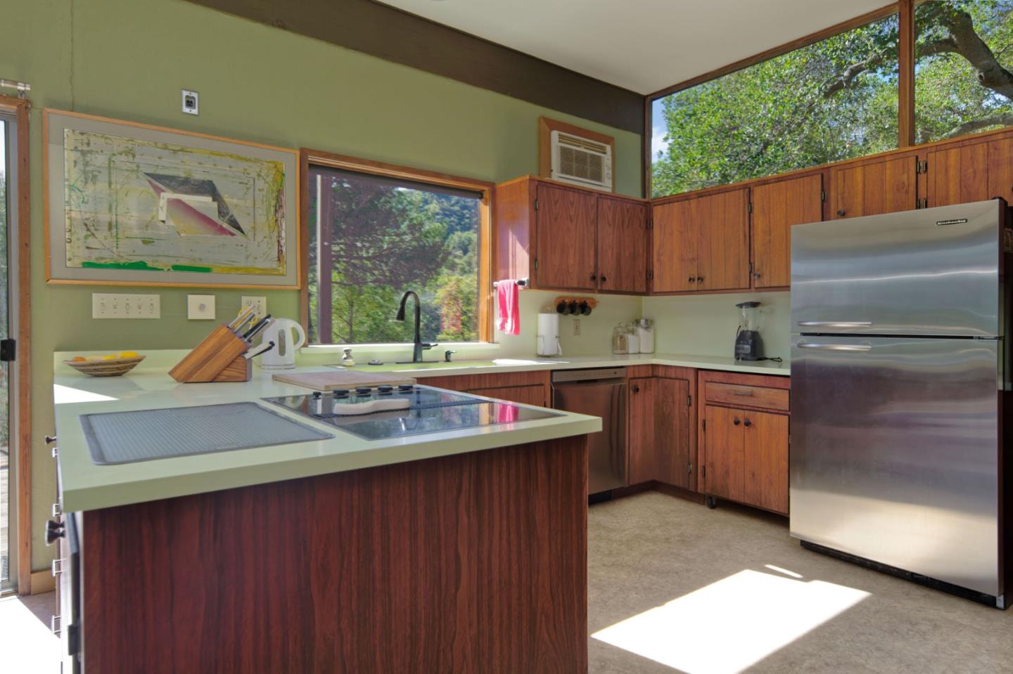 26969 Moody Road Los Altos Hills, CA 94022 - Photo 32 of 52 a kitchen with a stove a refrigerator and a sink