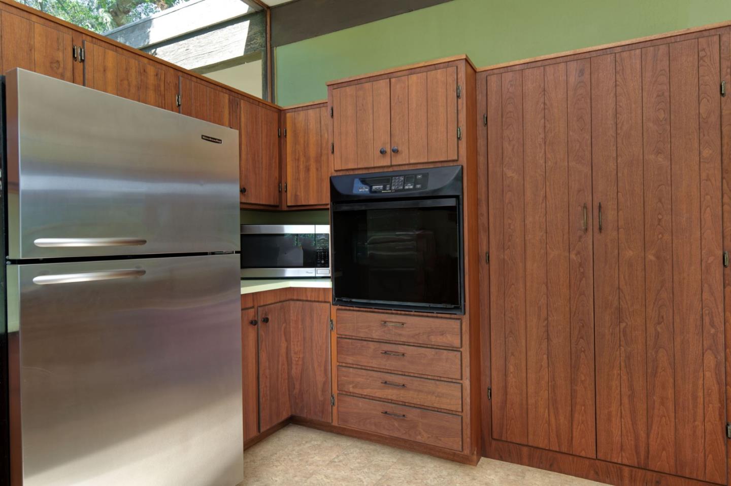 26969 Moody Road Los Altos Hills, CA 94022 - Photo 33 of 52 a kitchen with cabinets and stainless steel appliances