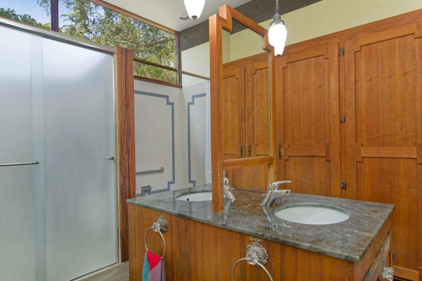 26969 Moody Road Los Altos Hills, CA 94022 - Photo 38 of 52 a bathroom with a granite countertop sink and a mirror