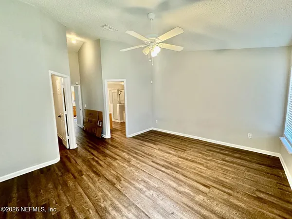 a view of a livingroom with wooden floor