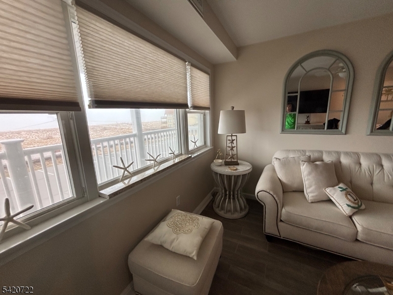 1935 Oceanfront, Unit 20 Seaside Heights, NJ 08751 - Photo 14 of 16 a living room with furniture and a large window