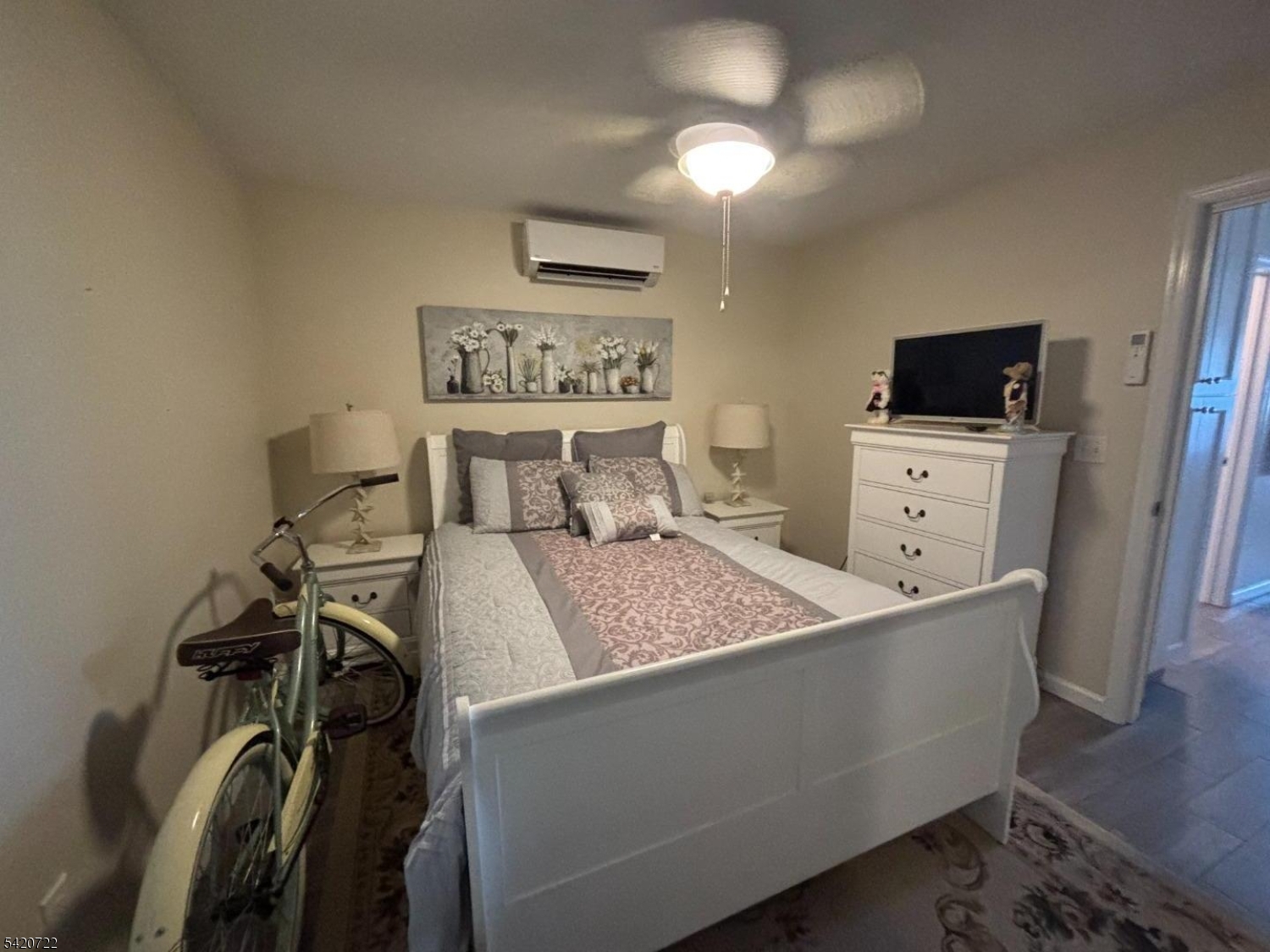 1935 Oceanfront, Unit 20 Seaside Heights, NJ 08751 - Photo 6 of 16 a bedroom with a bed and a tv