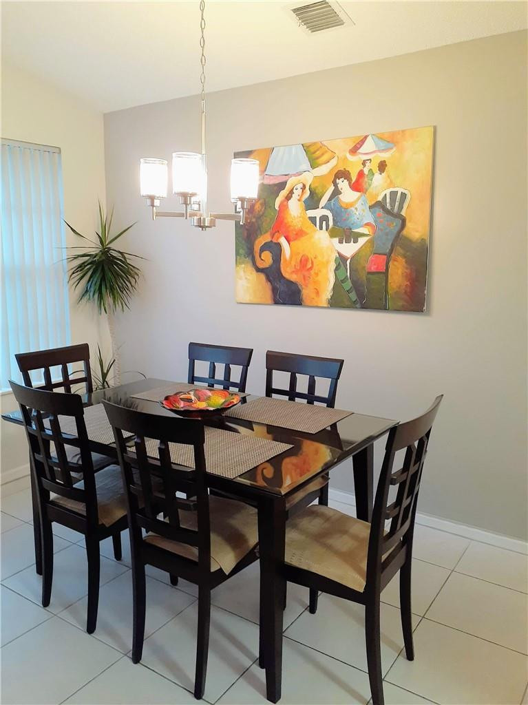 2 Glamis Way, Unit 2 Boynton Beach, FL 33426 - Photo 11 of 19 a dining room with furniture and window