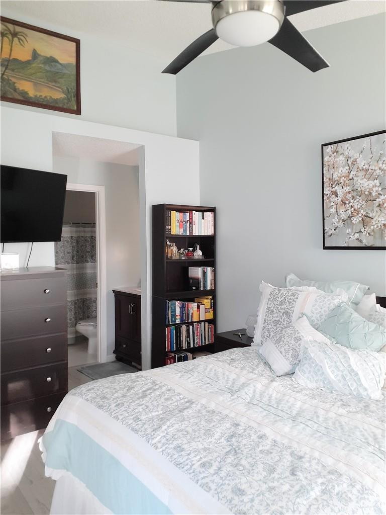 2 Glamis Way, Unit 2 Boynton Beach, FL 33426 - Photo 16 of 19 a bedroom with a bed and a television