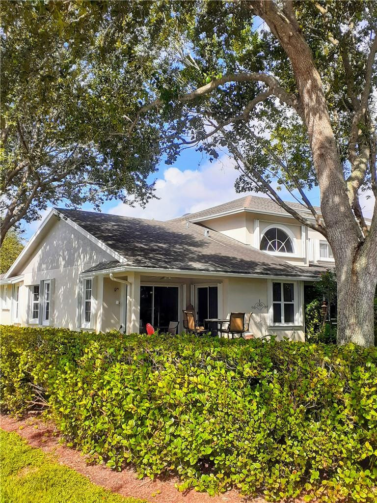 2 Glamis Way, Unit 2 Boynton Beach, FL 33426 - Photo 4 of 19 a front view of a house with a garden