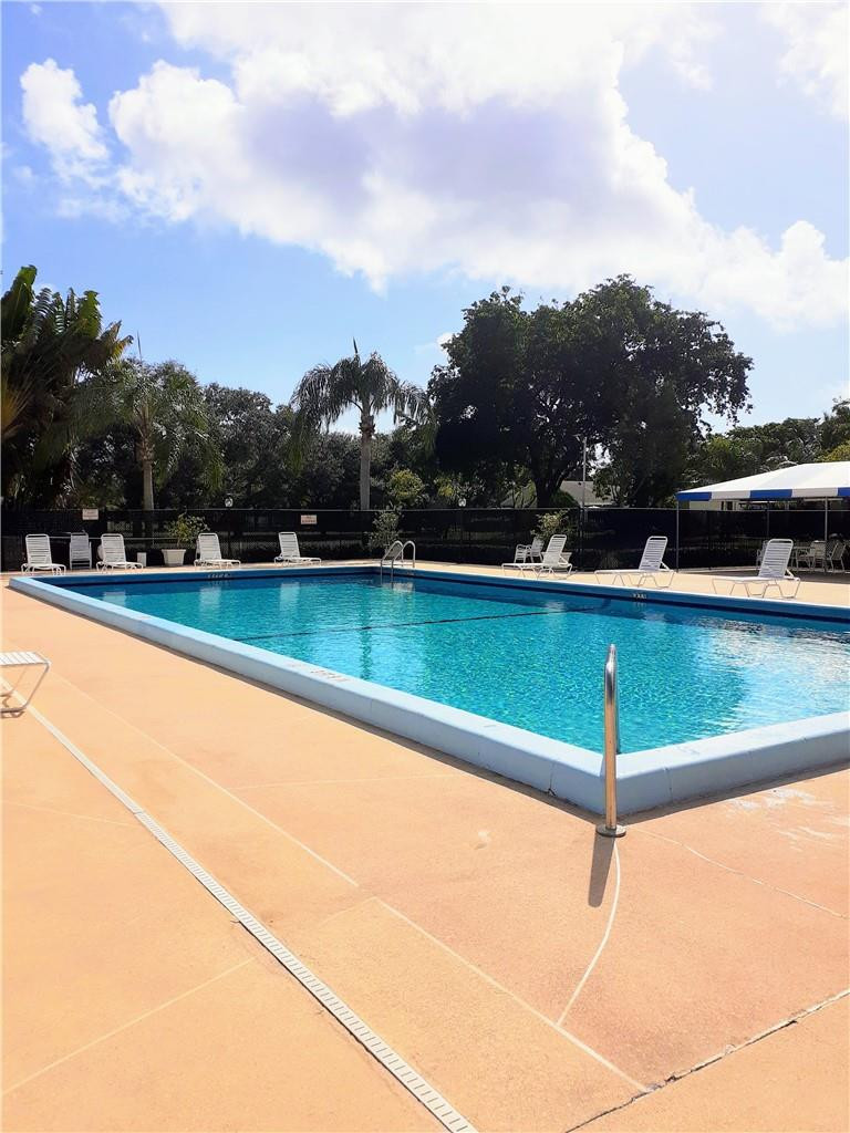2 Glamis Way, Unit 2 Boynton Beach, FL 33426 - Photo 6 of 19 a view of a swimming pool and outdoor space