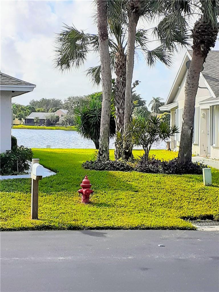 2 Glamis Way, Unit 2 Boynton Beach, FL 33426 - Photo 8 of 19 a view of a house with a big yard and potted plants