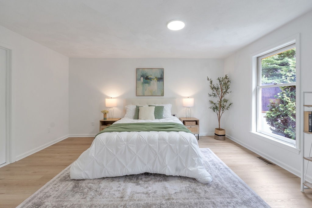 111 Brigham Street, Unit 13B Hudson, MA 01749 - Photo 17 of 23 a bedroom with a large bed and a window