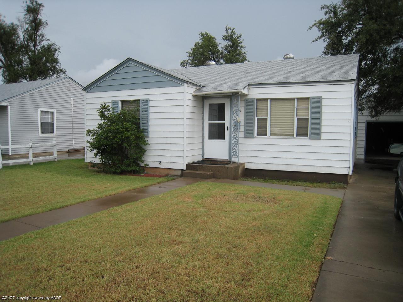 525 Southwest 45th Avenue Amarillo, TX 79110 - Photo 1 of 9 a view of a house with a yard