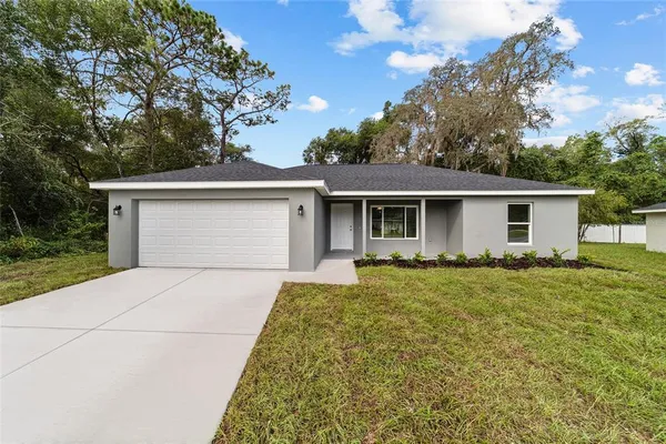 front view of a house with a yard