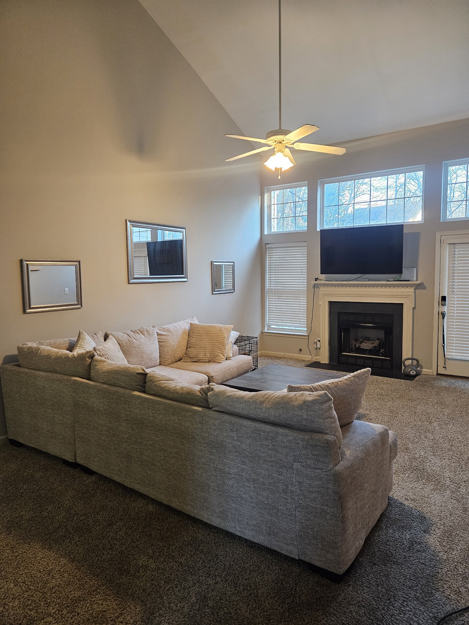 3401 Anderson Road, Unit 34 Antioch, TN 37013 - Photo 2 of 23 a living room with furniture a fireplace and a ceiling fan