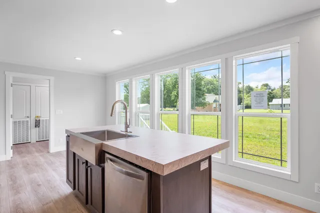 a kitchen that has a sink and a stove