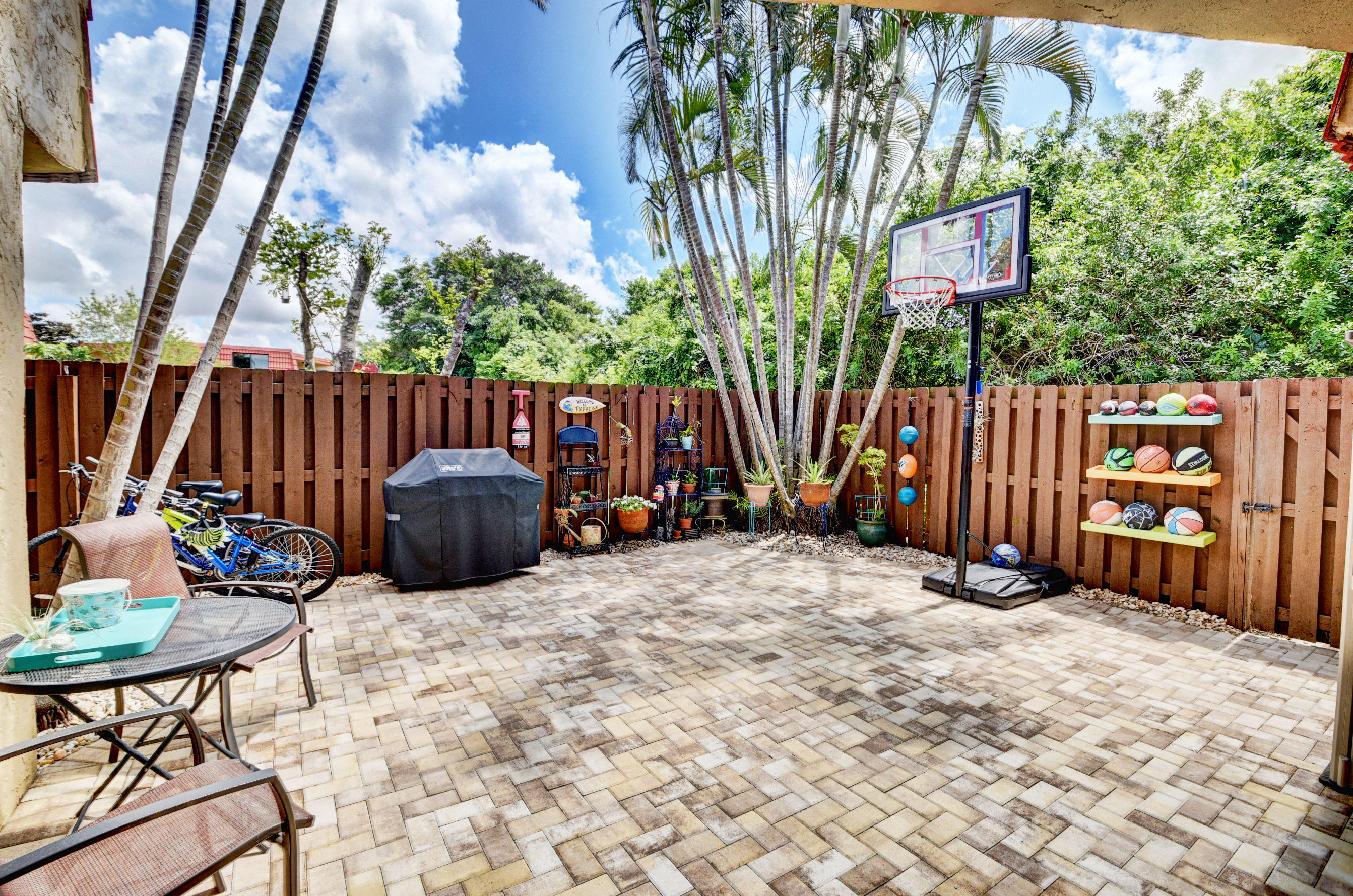8393 Trent Court, Unit D Boca Raton, FL 33433 - Photo 24 of 38 Paved courtyard w/mature palms