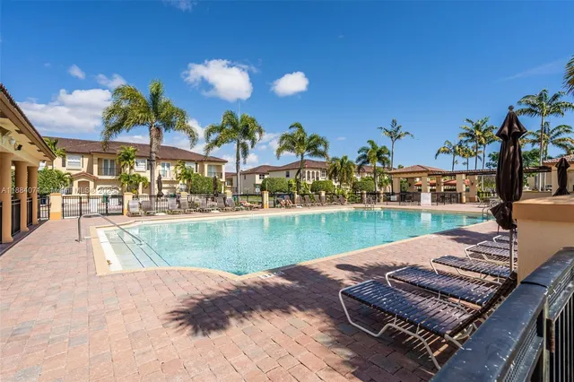 a view of a swimming pool with a patio