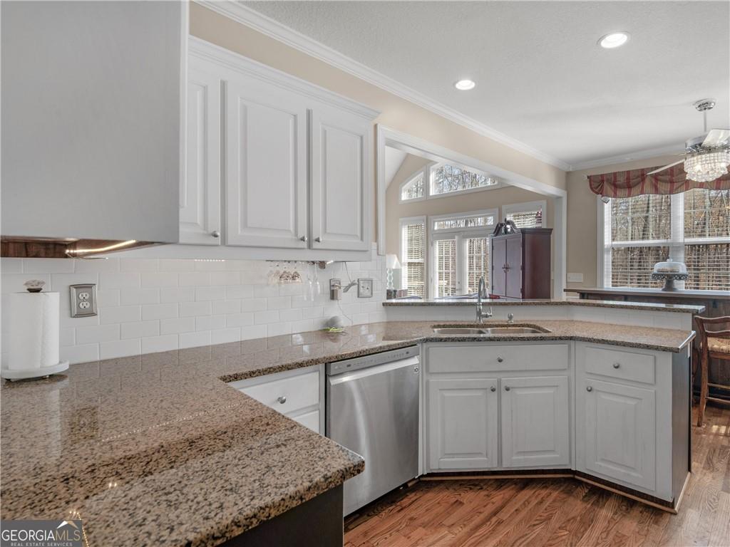355 Parker Road Covington, GA 30014 - Photo 25 of 60 a kitchen with a sink and cabinets
