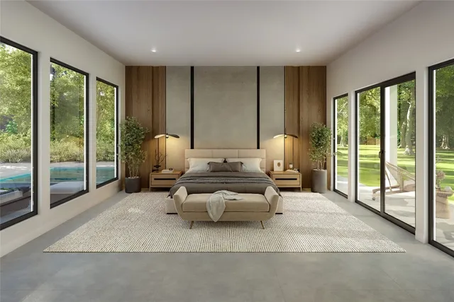 a living room with furniture and large windows