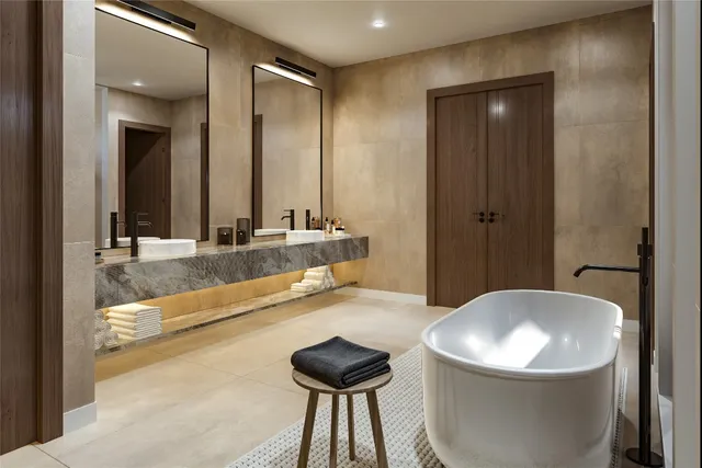 a bathroom with a tub and a sink