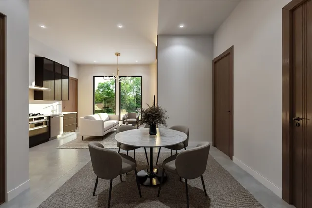a dining room with furniture a chandelier and window