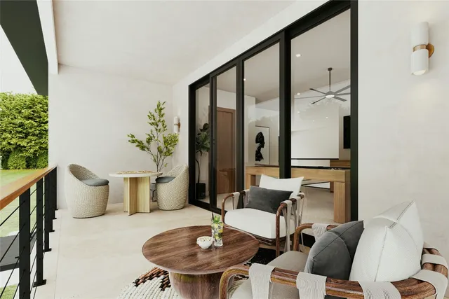 a living room with furniture a table and a potted plant
