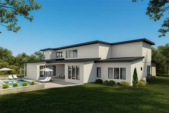a view of house with a big yard and potted plants