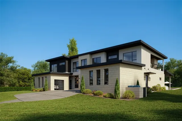 a front view of a house with a yard and trees