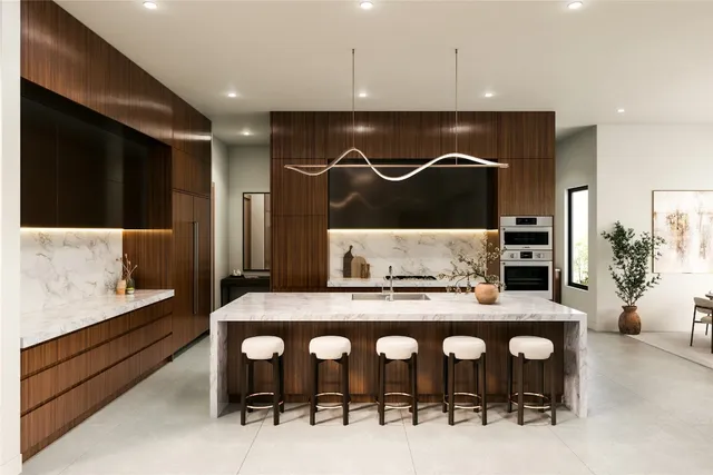 a kitchen with a table and chairs