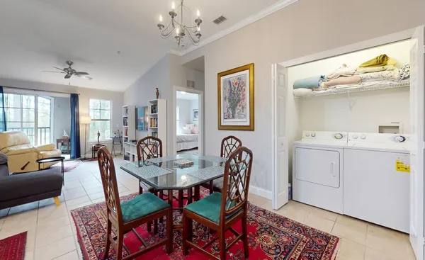 a view of a dining room with furniture and wooden floor