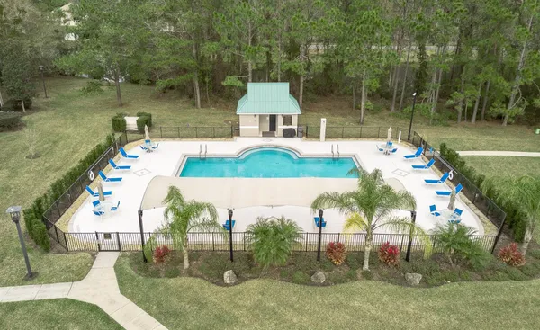 an aerial view of a house with outdoor space
