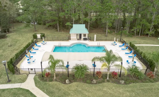 an aerial view of a house with outdoor space