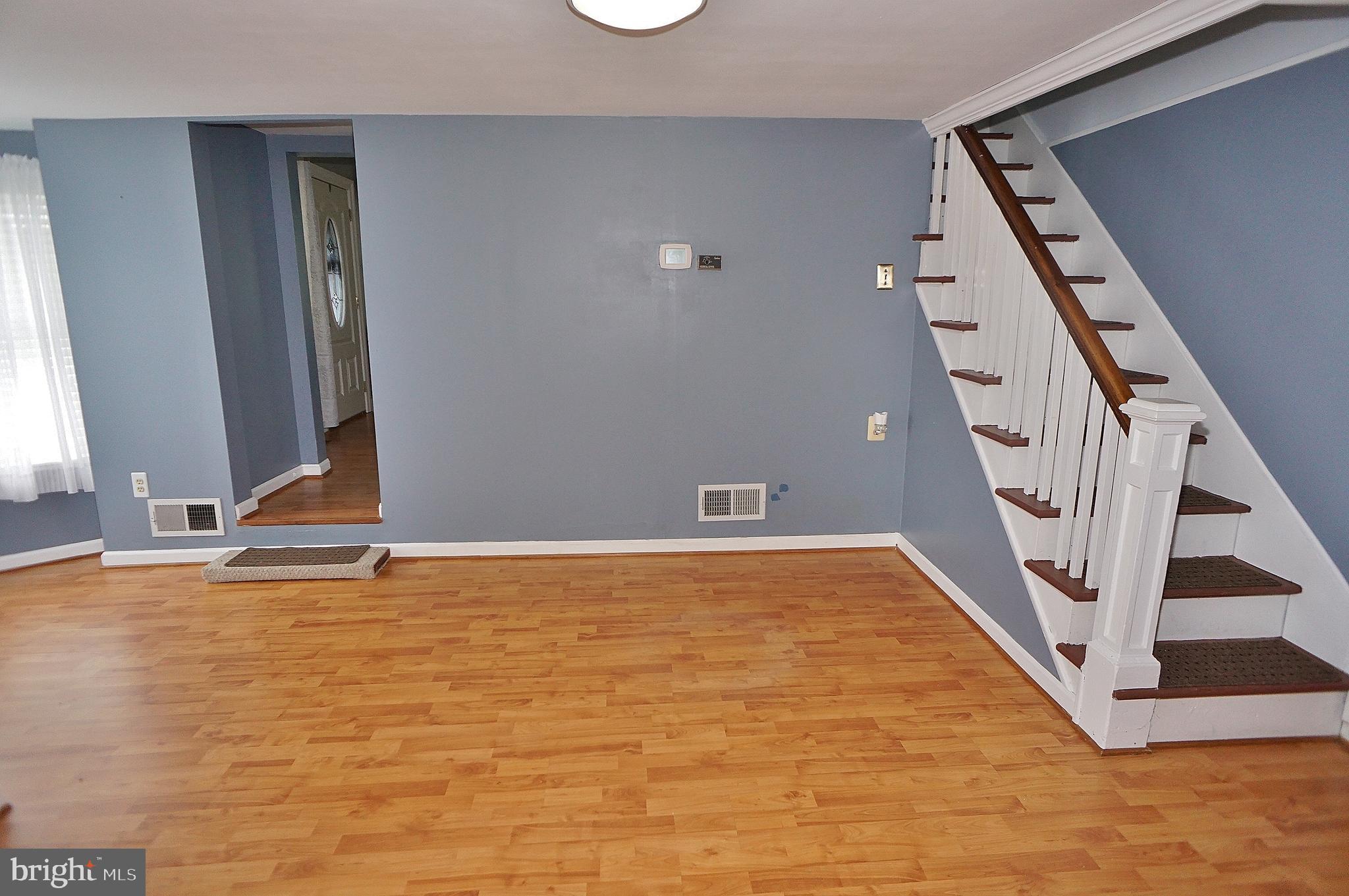 10 Upper Neck Road Pittsgrove, NJ 08318 - Photo 12 of 18 a view of an empty room with wooden floor and stairs