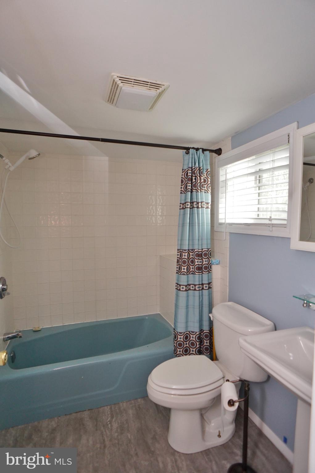 10 Upper Neck Road Pittsgrove, NJ 08318 - Photo 13 of 18 a bathroom with a sink a toilet a mirror and shower