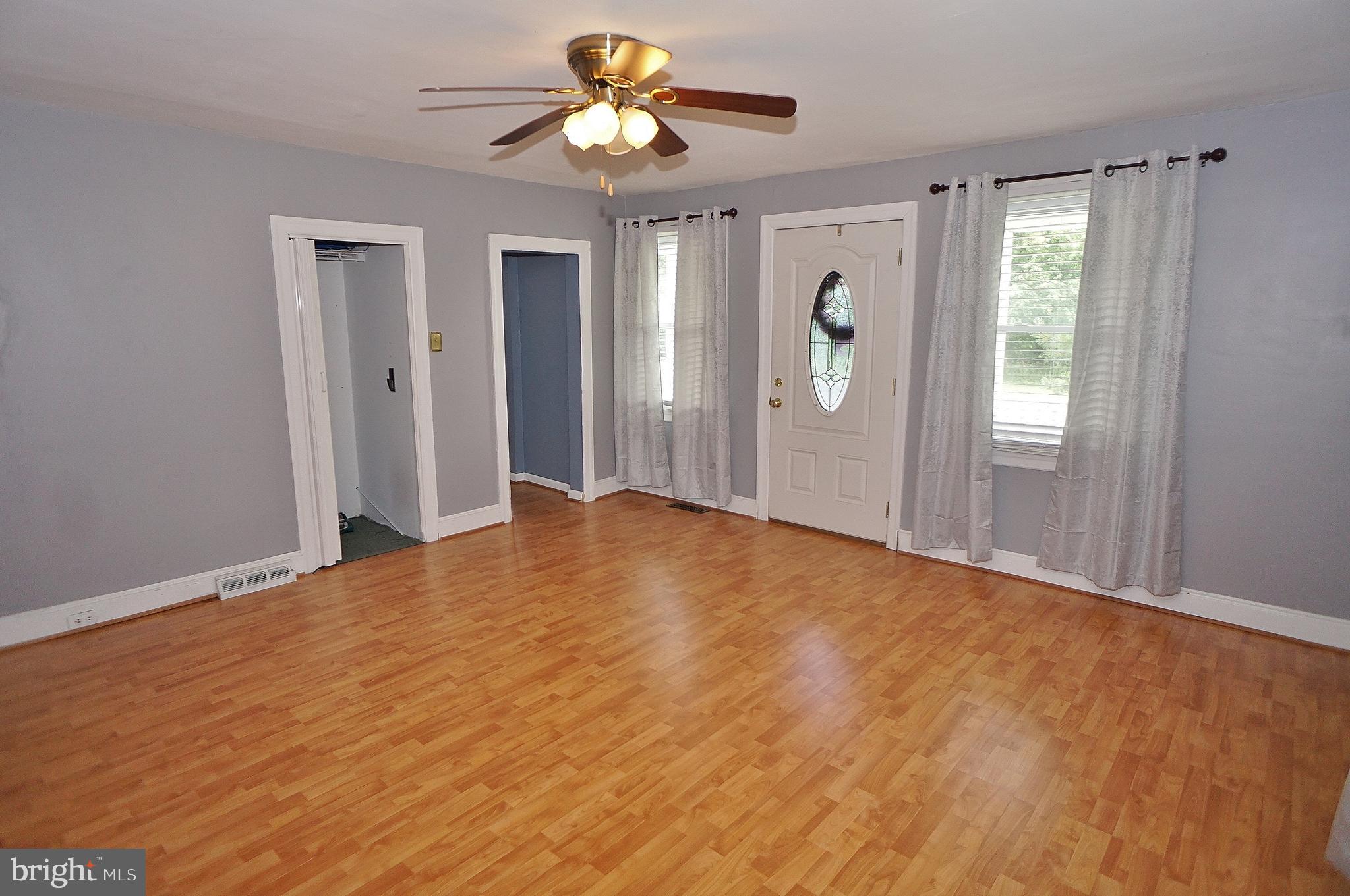 10 Upper Neck Road Pittsgrove, NJ 08318 - Photo 15 of 18 a view of an empty room with window and wooden floor