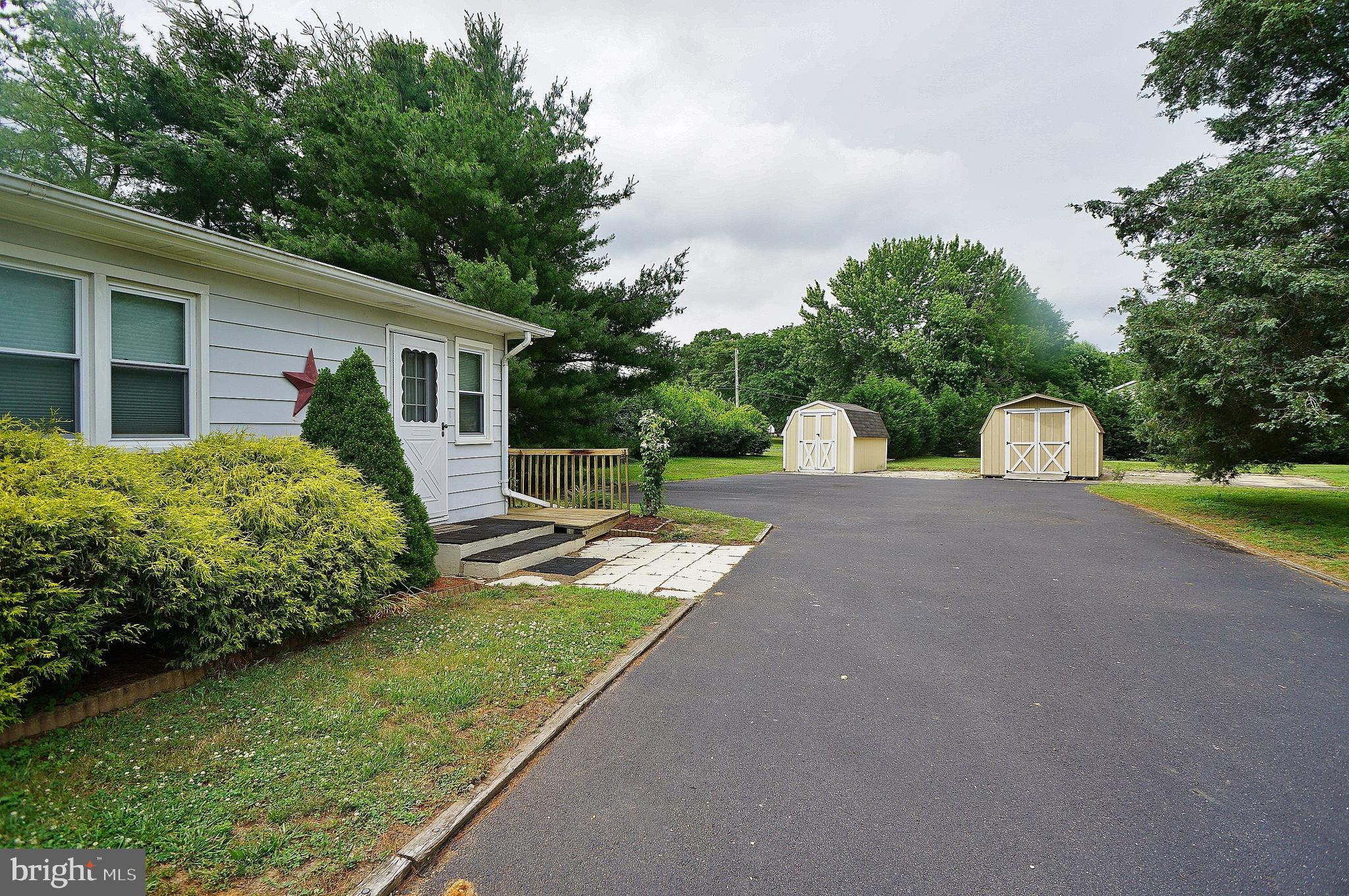 10 Upper Neck Road Pittsgrove, NJ 08318 - Photo 3 of 18 a front view of a house with garden