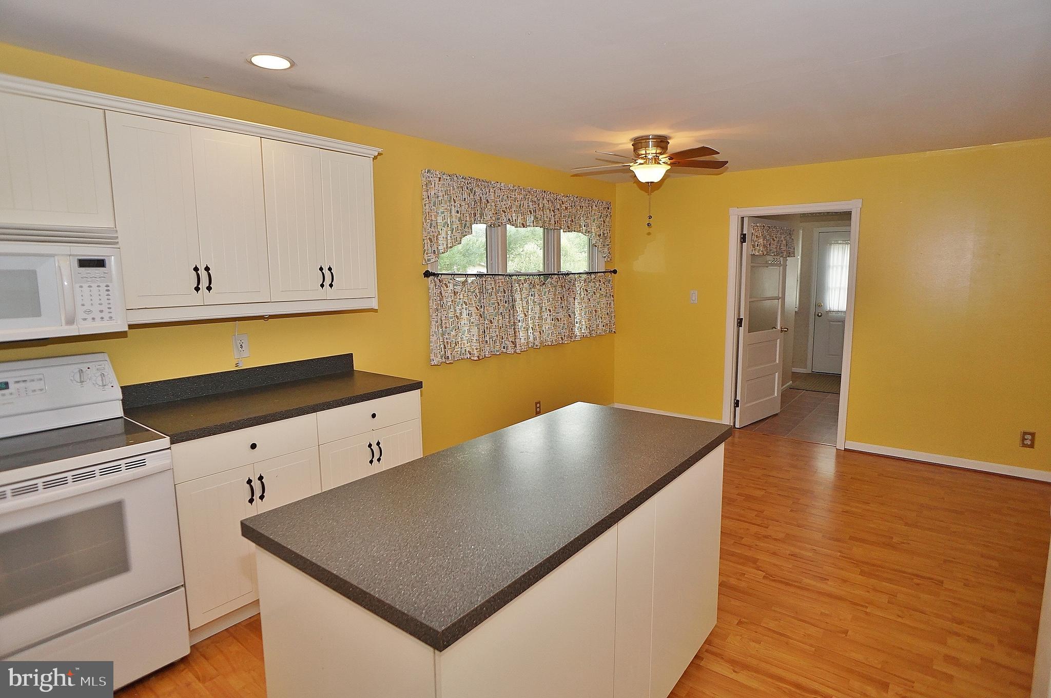10 Upper Neck Road Pittsgrove, NJ 08318 - Photo 8 of 18 a kitchen with wooden floor and window