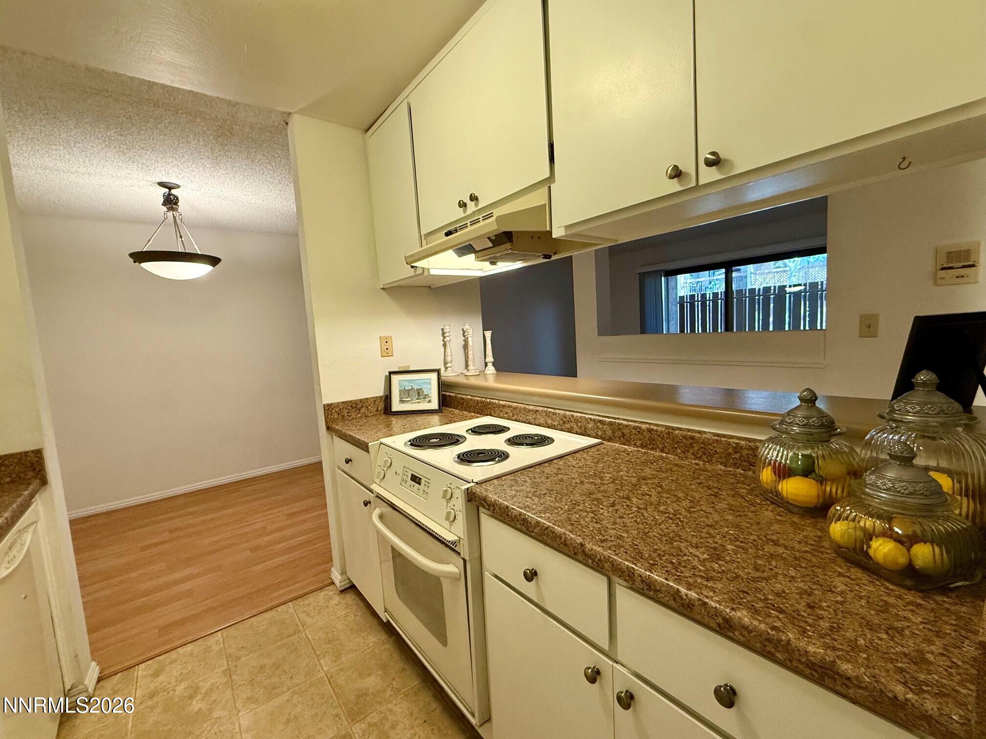 2955 Lakeside Drive, Unit 120 Reno, NV 89509 - Photo 10 of 21 a kitchen with a stove and a sink