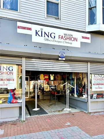 a view of a shop in a street