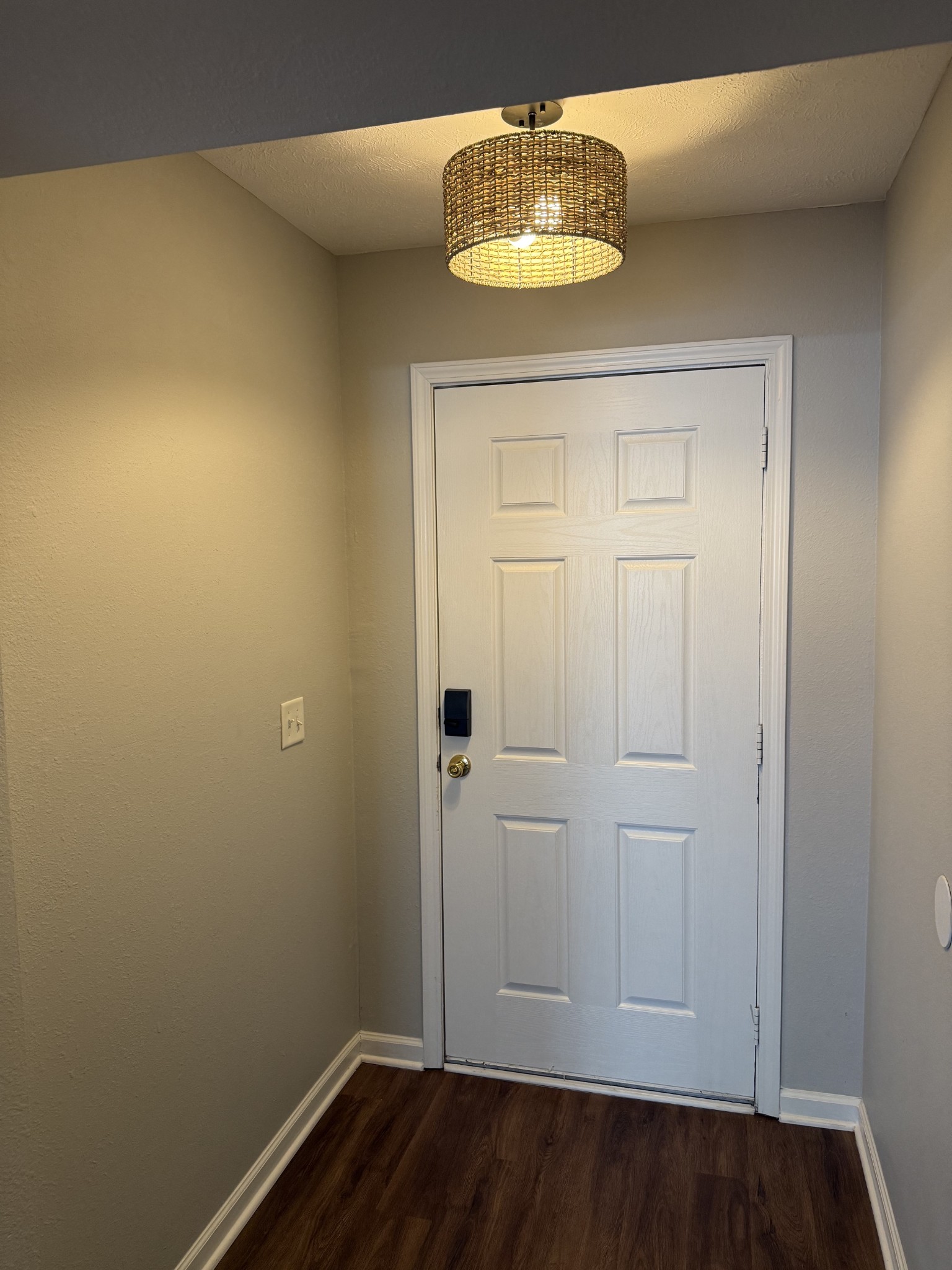 1026 Wolves Den Place Murfreesboro, TN 37128 - Photo 2 of 24 an empty room with a chandelier fan and wooden floor
