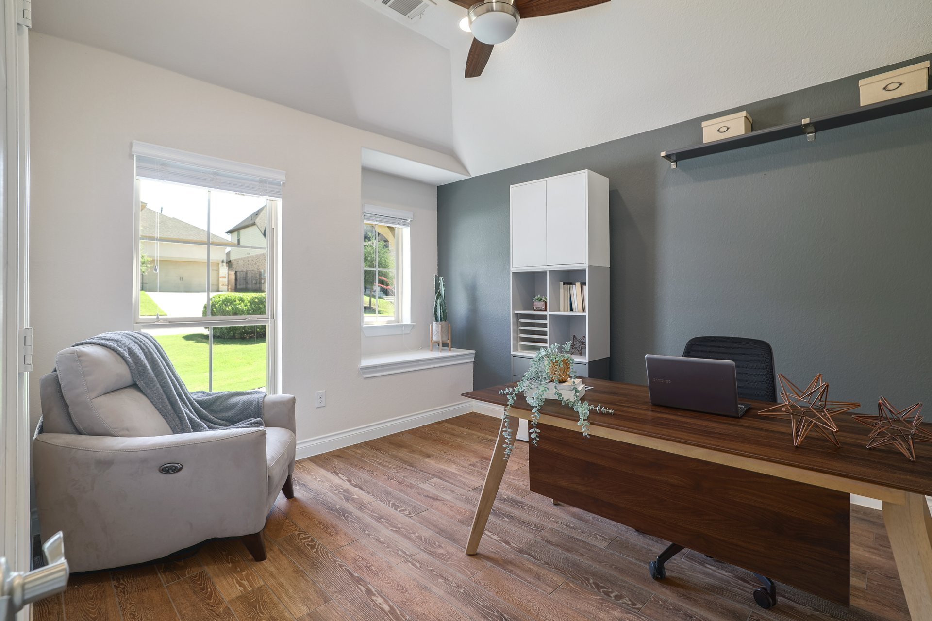 173 Santa Maria Street Georgetown, TX 78628 - Photo 25 of 39 Room featuring wood-finish flooring, vaulted ceiling, complete with ceiling fan.