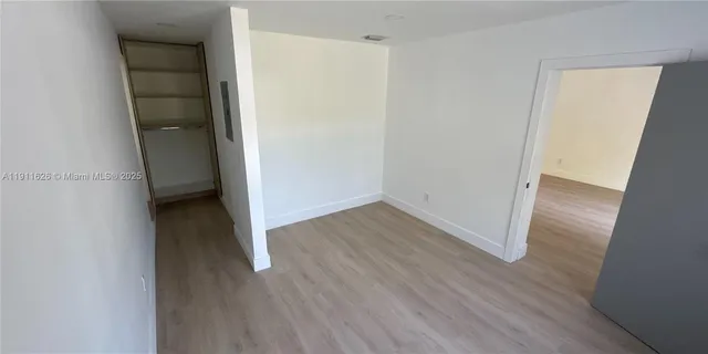 a bathroom with a shower and toilet