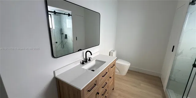 a view of a livingroom with wooden floor