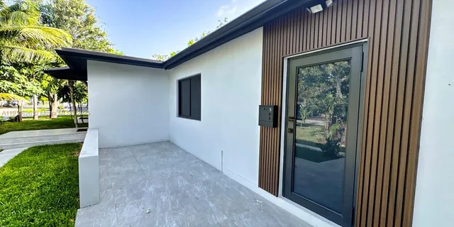 view of a pool with a chair and table