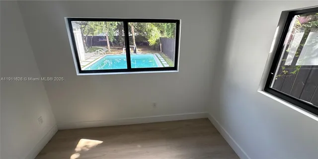 a view of a park with large trees