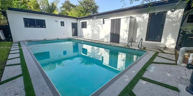a view of a wooden floor and chairs in patio
